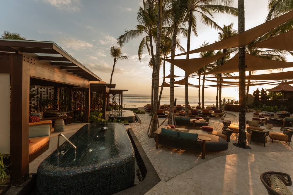 A private pool cabana with its own jacuzzi at Alunê, facing the ocean at sunset