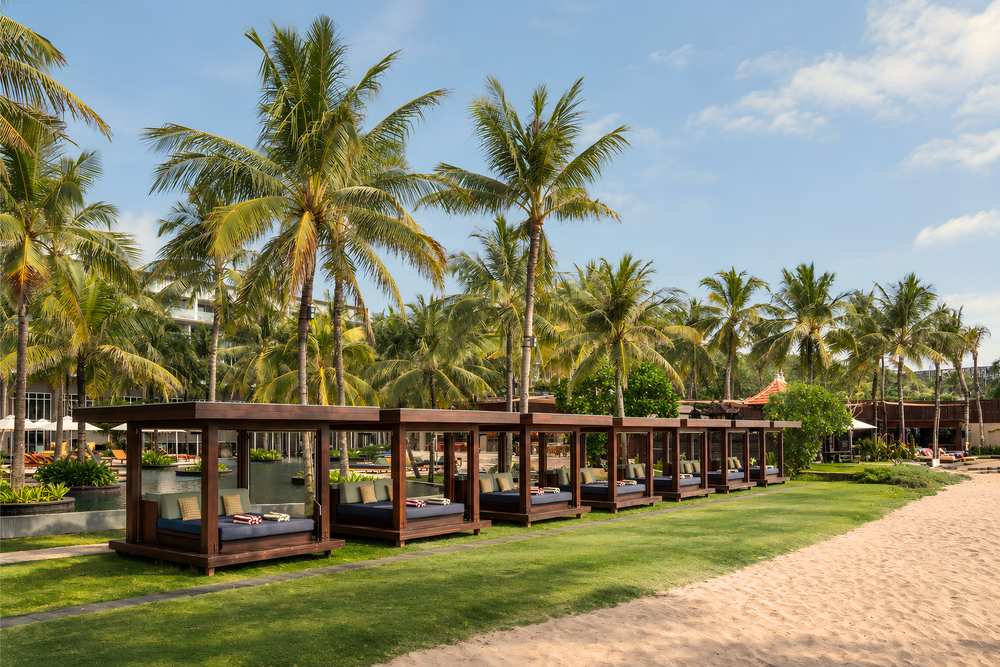 Beach cabanas on the lawn along Seminyak Beach at Alunê