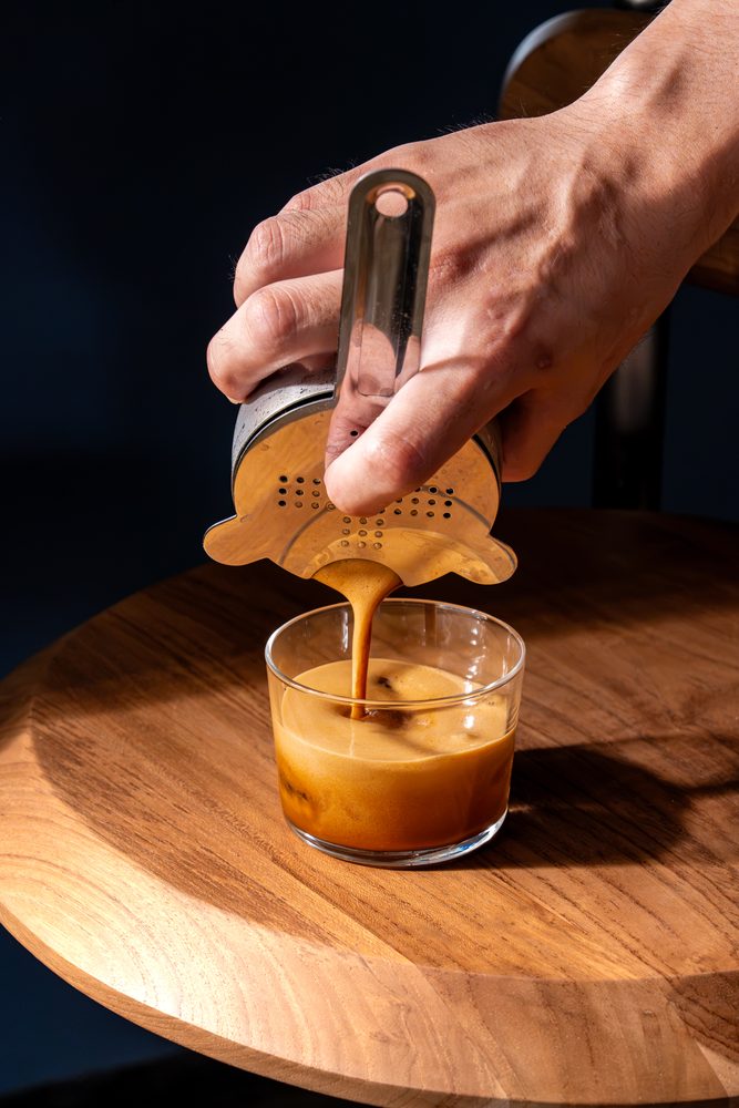 Shaken espresso being strained at Micrology Canggu