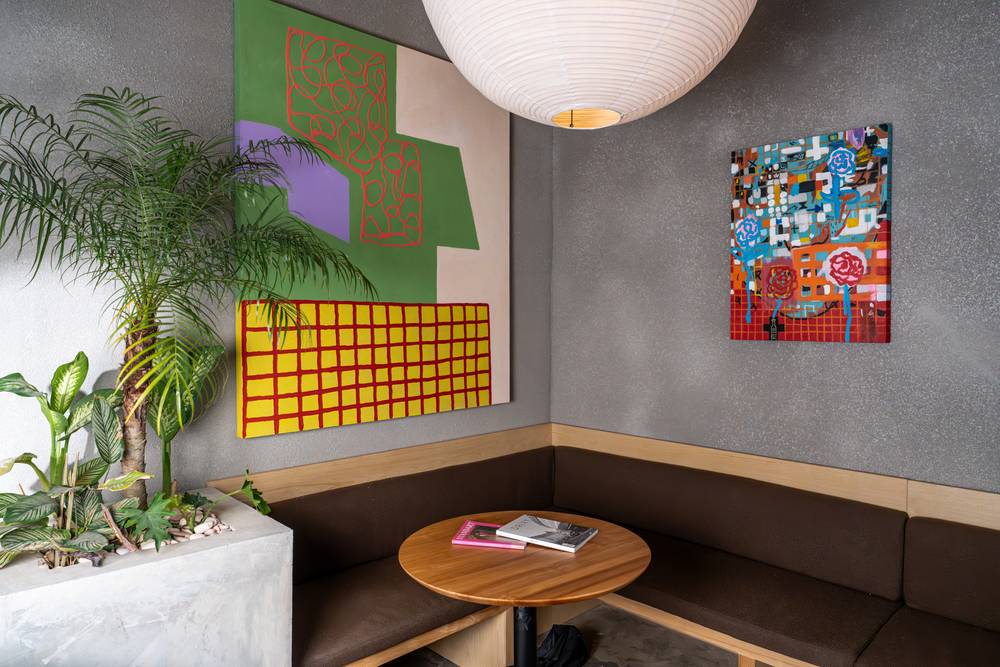 Artwork and banquette seating inside Micrology Canggu