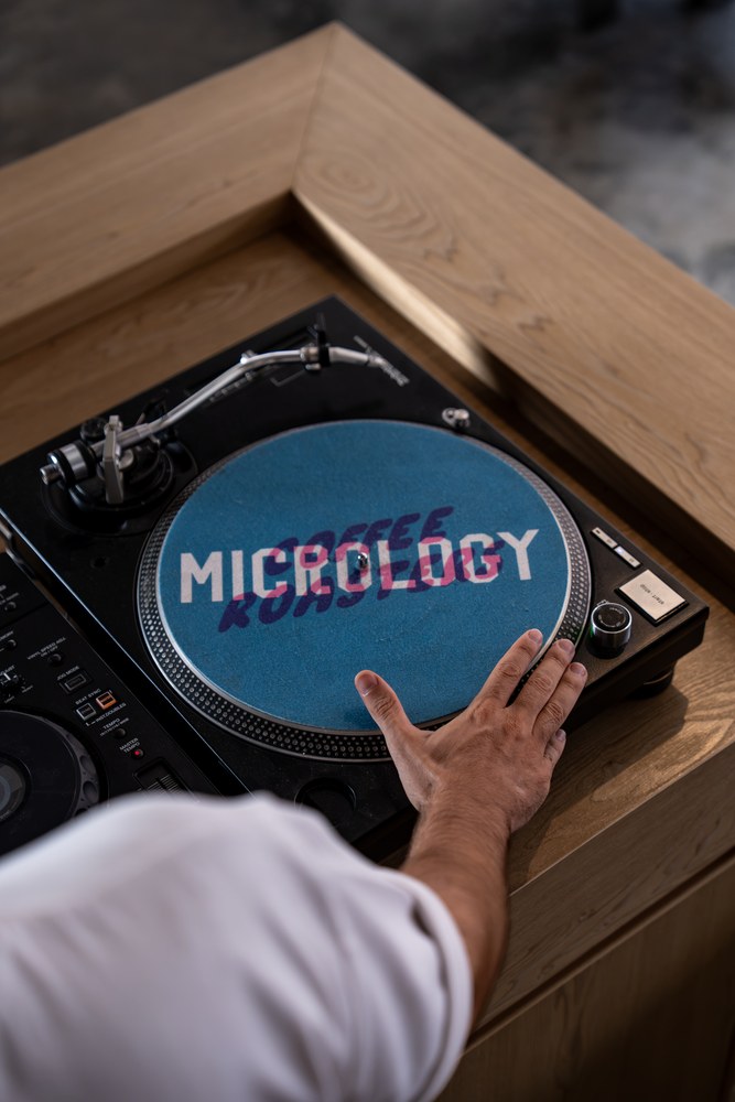 Custom DJ booth turntable at Micrology Canggu