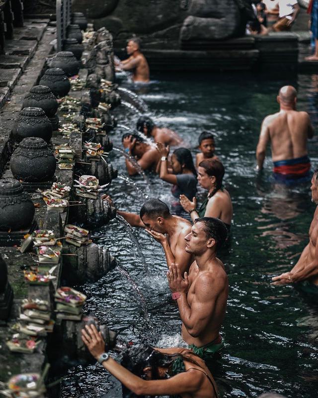 Take a purification bath at Tirta Empul