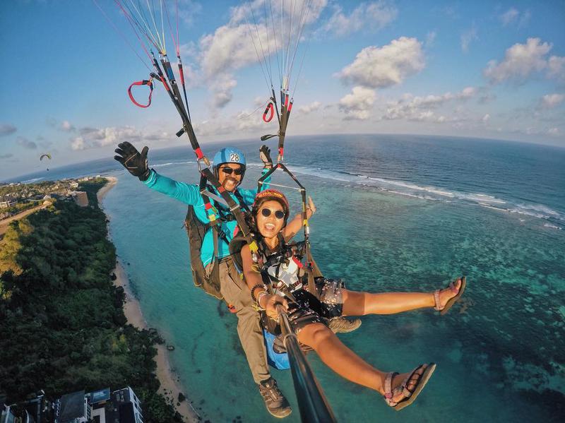 Go tandem paragliding on the Bukit