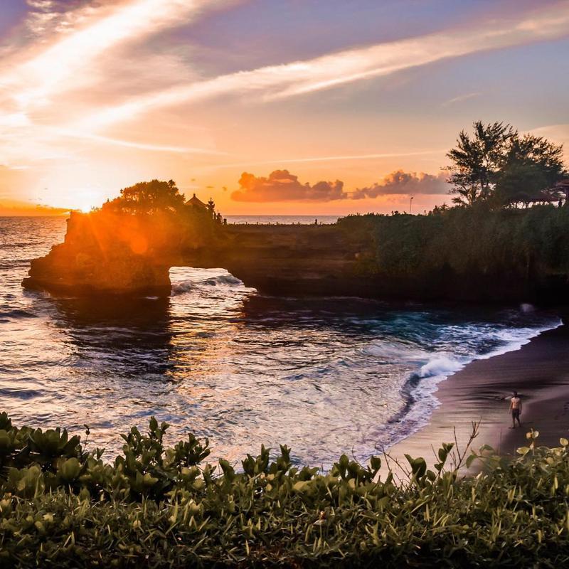 See the sunset at Tanah Lot